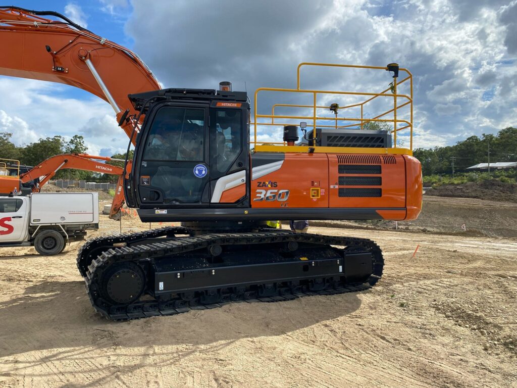Orange Hitachi excavator at a construction site in Brisbane.